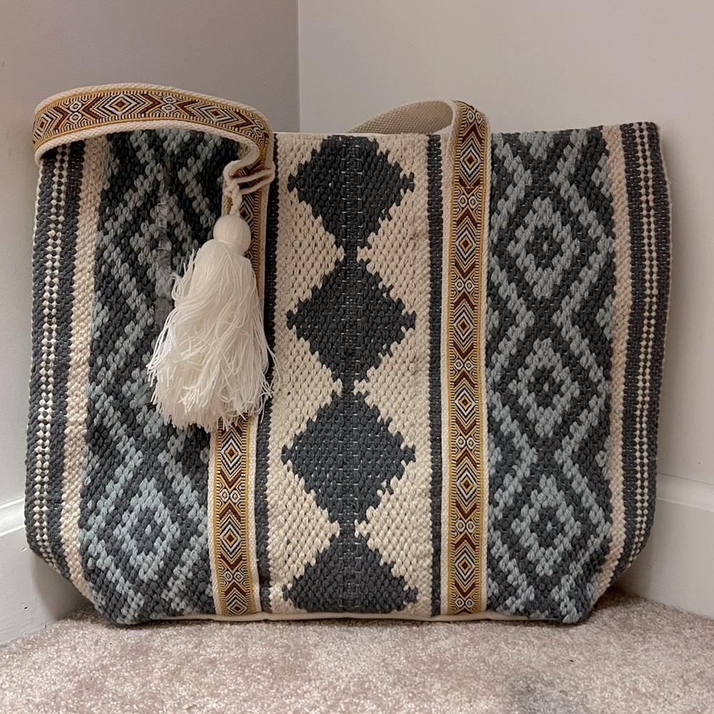 Blue crocheted Aztec print tote bag.